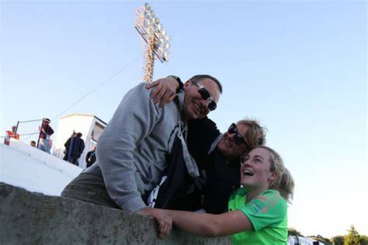 A jubilant Leat with parents Steven and Jackie at the World Cup. Photo / Getty Images