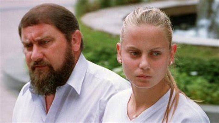 Damir Dokic father of Jelena Dokic watches her in action against Kristina Brandi of America at Wimbledon in 2000. Photo / Getty
