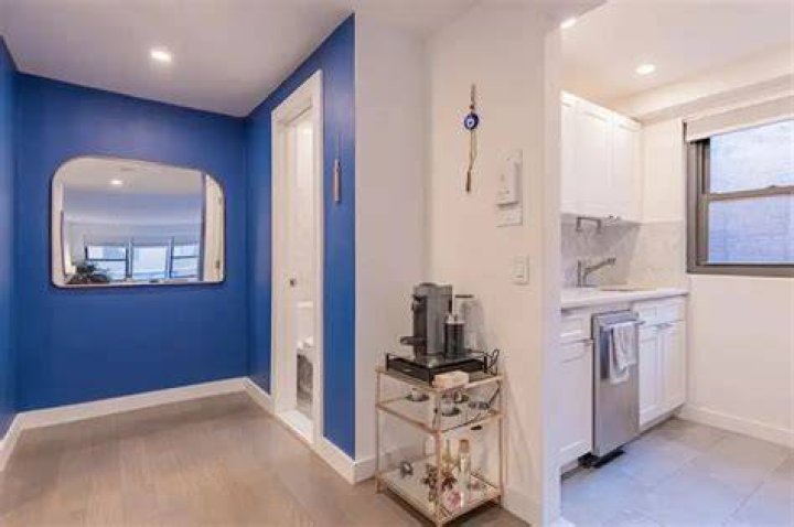 Foyer and windowed kitchen
