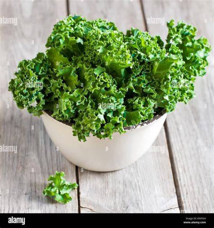 Fresh green kale in ceramic bowl