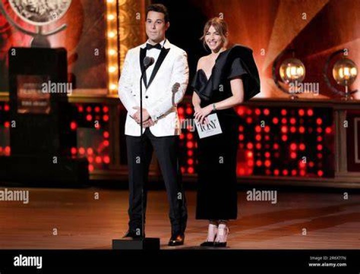 Hosts Skylar Astin, left, and Julianne Hough speak on stage. Photo / AP