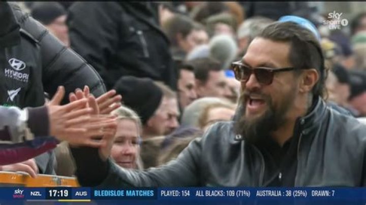 Jason Momoa cheered on the All Blacks as they played the Wallabies in Dunedin over the weekend. Photo / Sky TV