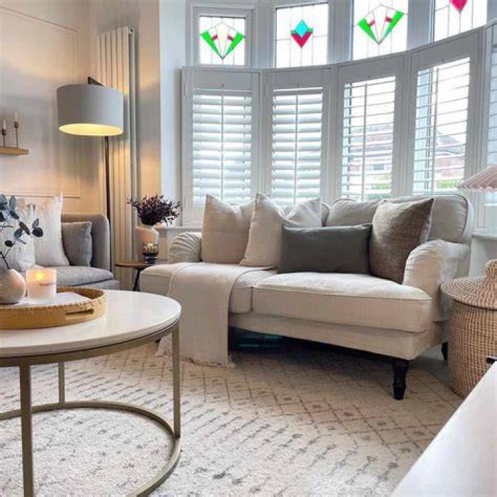 Living room with bay window and river views