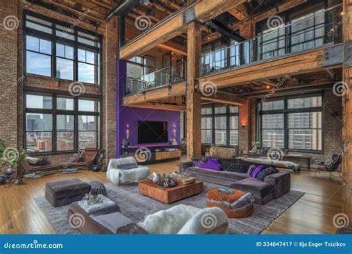 Loft with oversized windows and beamed ceiling