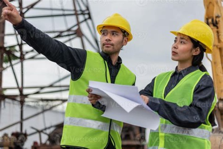 Man and woman construction volunteers