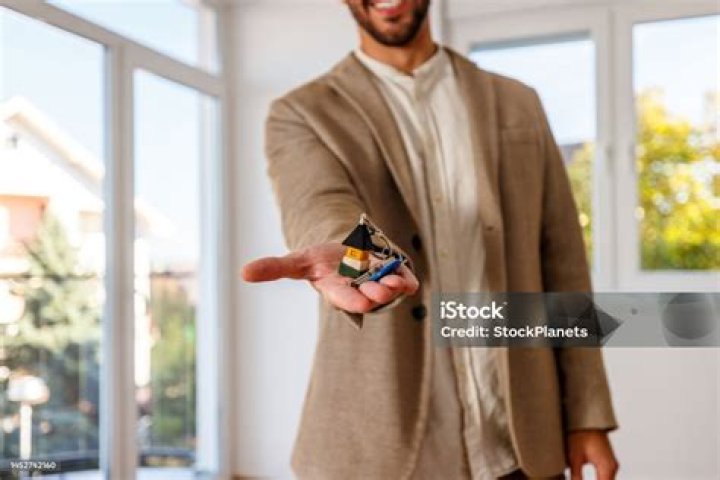 Man holding keys of his shack Man holding keys of his shack