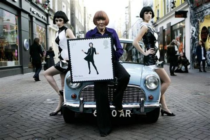 Mary Quan poses in London on January 9, 2009 with a replica of a special commemoration stamp of British Design Classics. Photo / AP