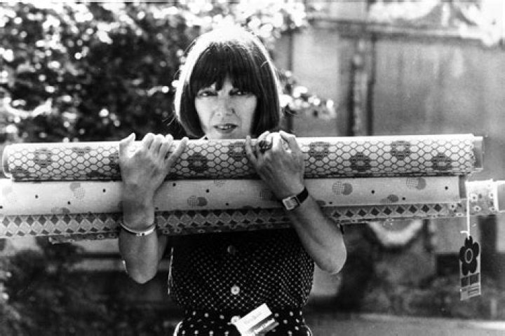 Mary Quant carries rolls of fabric in her arms, which were used for her new designs shown at the Savoy Hotel earlier, in London, England on September 18, 1974. Photo / AP