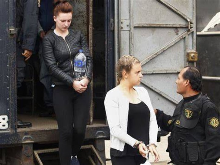 McCollum and Reid are escorted to court. Photo / File