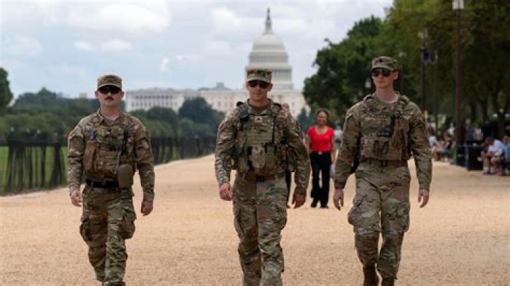 Members of the National Guard arrive to secure the area outside the Capitol on Wednesday evening. Photo / AP 