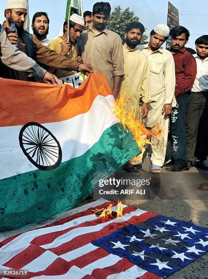 Pakistani Islamists burn the US flag at a rally. Photo / AP