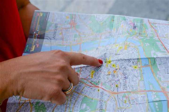 person pointing at metro map in barcelona