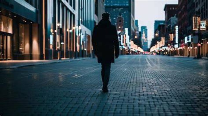 person walking down the street in shibuya japan