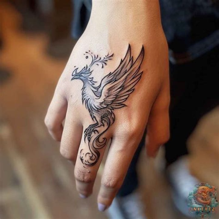 Phoenix hand tattoos Phoenix hand tattoos