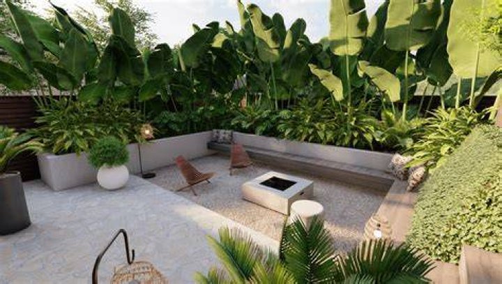 Private terrace with landscaping and partial river views