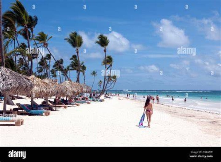 Punta Cana, Dominican Republic woman standing on the beach at sunrise