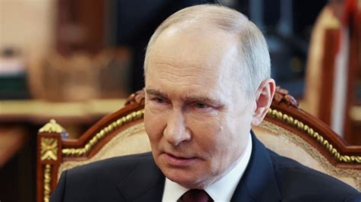 Russian President Vladimir Putin (centre) flanked by Alexei Dyumin, acting governor of the Tula region (left) and Russian Defence Minister Sergei Shoigu. Photo / AP
