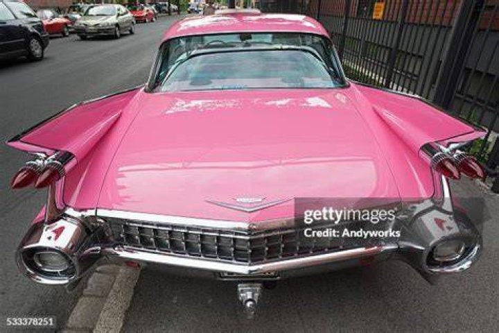 The pink Cadillac is removed from Kim Dotcom's then Coatesville mansion in Auckland on January 20, 2012. Photo / Getty Images