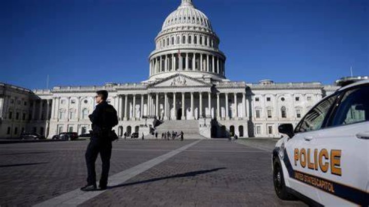 US Capitol Police hold protesters at gun-point near the House Chamber inside the Capitol. Photo / AP 
