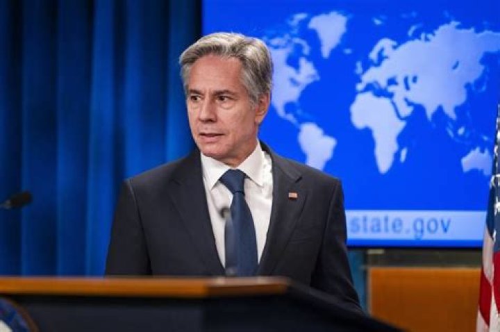 US Secretary of State Antony Blinken (R) and Philippines Secretary of Energy Raphael Lotilla sign a nuclear energy cooperation agreement in San Francisco, as Philippine President Ferdinand Marcos looks on