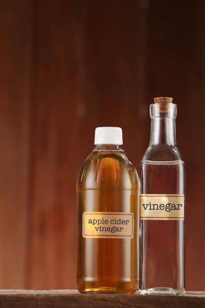 white vinegar on the wooden table top