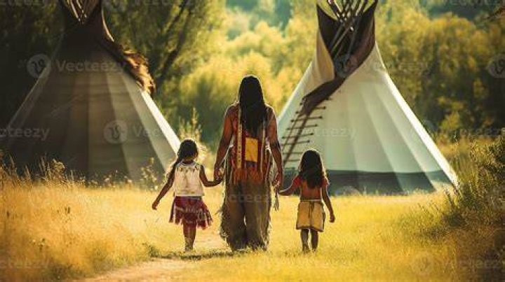 Women walking with children down road in Madagascar